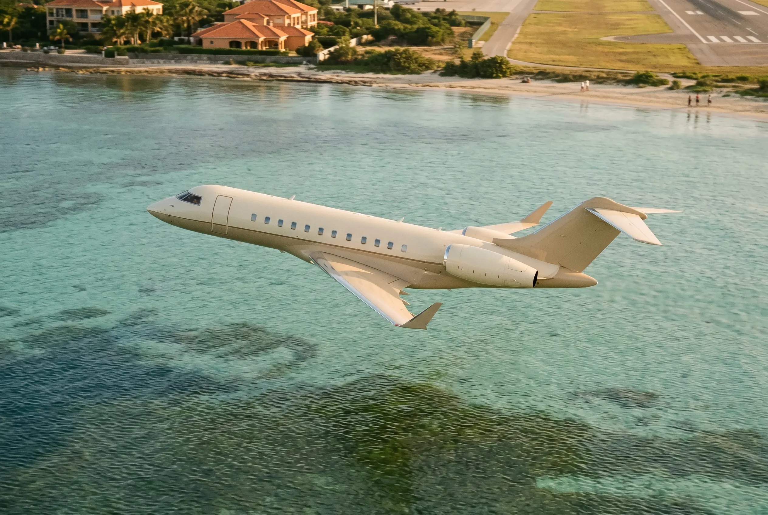 G500 New-generation large-cabin jet banking over turquoise shallows shortly after takeoff